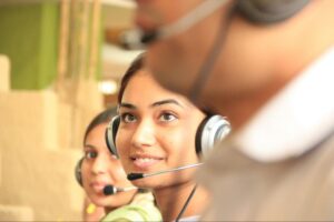 Modern BPO team using AI, automation, and cloud platforms in a smart hub environment to deliver customer service and data-driven insights.